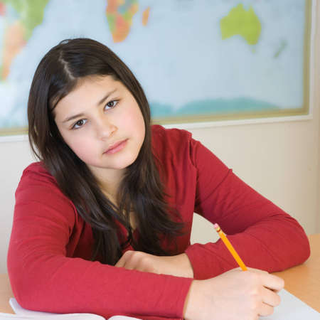 Teen girl doing her homework