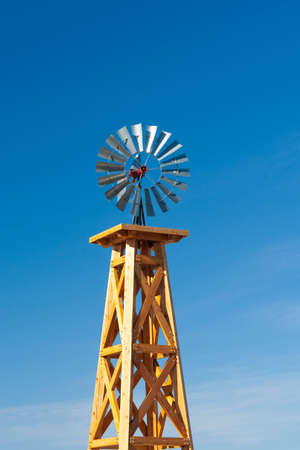 Small wind turbine on top of wooden tower