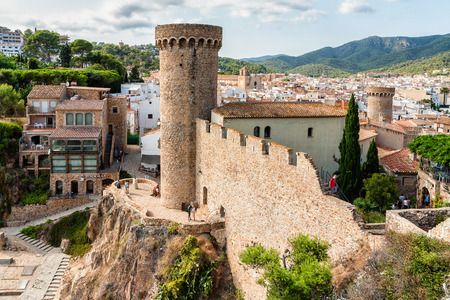 Towers of medieval fortification wall in Tossa de Mar, Costa Brava, Spain. Photo taken on sunny day.のeditorial素材