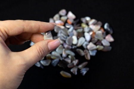 Natural Agate in hand, various types and color, gems mineral collection as nice natural background
