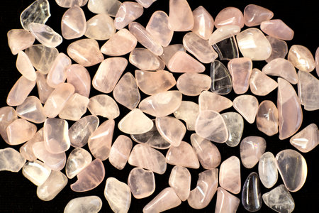 Several pieces of polished pink quartz as nice background. Minimal color still life photography