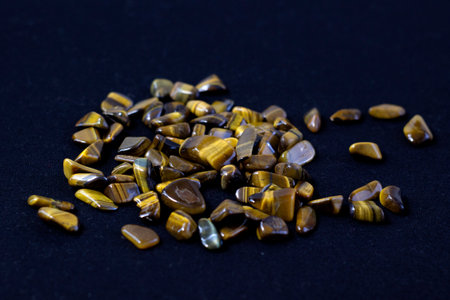 Natural mineral gem stone Tigers eye Tigers eye, Tiger eye gemstone on black background close upの写真素材