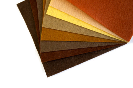 Set of yellow and brown color felt samples, multicolor, bright, closeup on white background top viewの写真素材