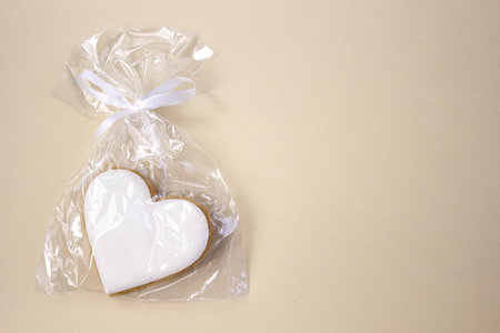 Appetizing gingerbread with frosting, close-up on a beige background with copyspace top viewの写真素材