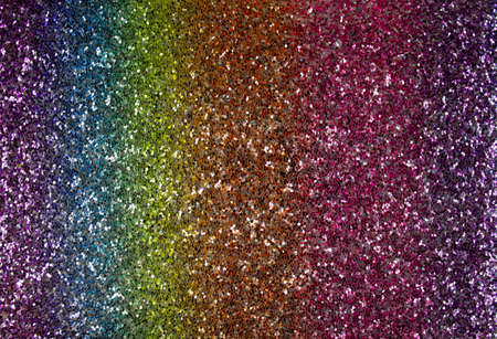 Texture of rainbow sparkles, close up, bright colorful textured surface top viewの写真素材