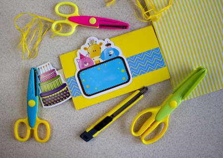 Bright yellow stationery set for making DIY cards, paper, clipping, closeup top viewの写真素材