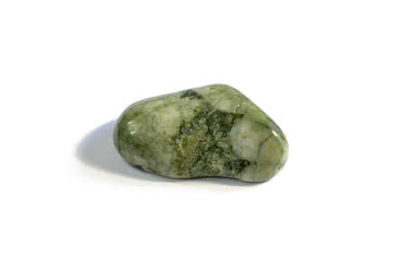 Macroshooting of natural mineral rock specimen - tumbled green aventurine gemstone isolated on white...