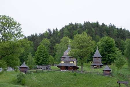 Old White Wooden Church in Rural Field Scene on hills