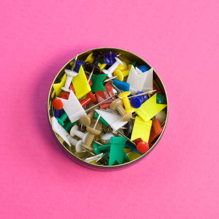 Rainbow Colored Straight Pins Collection in tin can on bright pink backgroundの写真素材