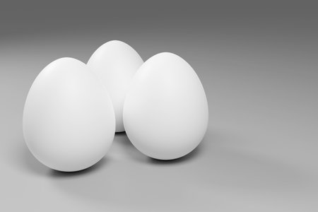 3d rendered white eggs on grey background for wallpapers, greeting cards, posters, ads.の写真素材