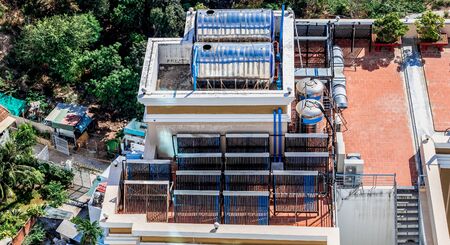 Designing a solar water heating system on the roof of a house. View from aboveの写真素材