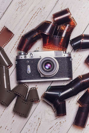 An old retro camera with photographic films. vintage photo