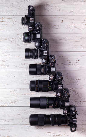 Old retro cameras with different lenses in size. view from above.の写真素材
