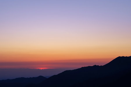 Silhouette of a mountain range before sunrise. blue hourの写真素材