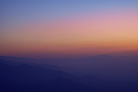 View of mountain ranges in the evening haze. blue hourの写真素材