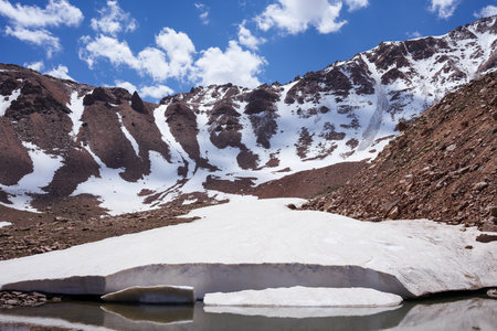 A melting glacier at the foot of a mountain range. climate changeの写真素材