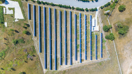 Large solar power plant with fenced area. green energyの写真素材