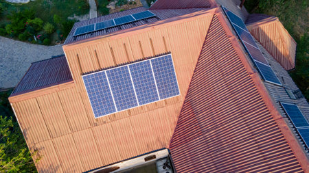 Solar panels on the south side of the house's roof. Green energyの写真素材