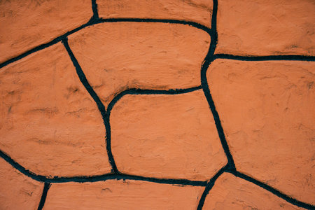 Wall with cement plaster and streaks of black paint. Concrete background
