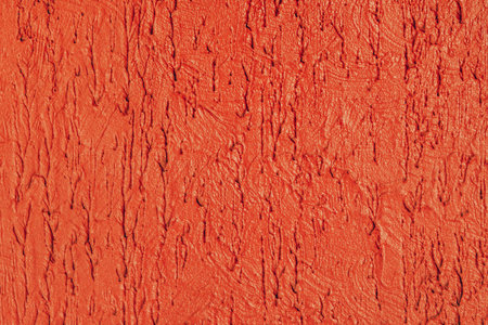 Decorative glossy plaster with red streaks. Concrete backgroundの写真素材