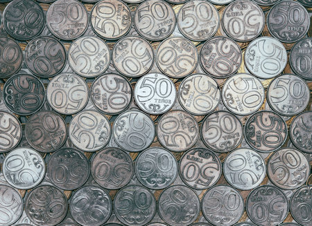 Rows of coins with face value of 50 tenge, top view. Cash in circulationの写真素材