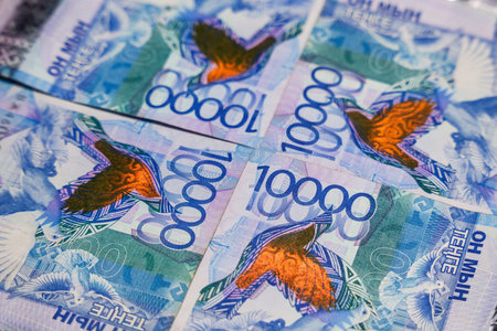 10,000 tenge banknotes connected at the corners. paper money