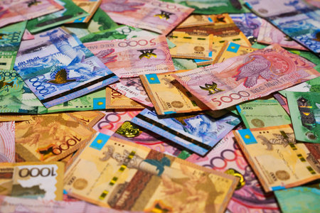 Many tenge banknotes of different denominations. Accounting report