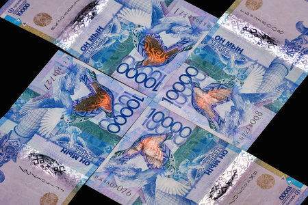 10,000 tenge bills laid out in a cross. paper money