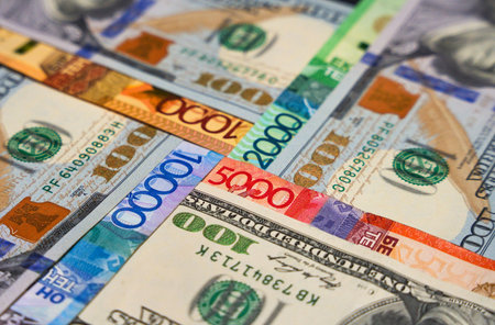 Dollars laid out in a cross in tenge. Currency exchangeの写真素材
