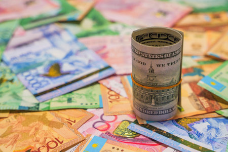 A 100 dollar bill with the inscription "In God we trust" costs tenge. Currency exchangeの写真素材
