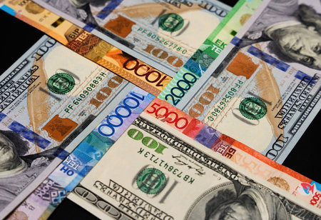 United dollar and tenge bills in the form of a cross. Currency exchangeの写真素材