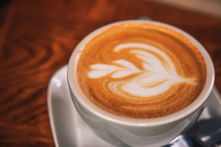Coffee mug with a pattern on the foam surface. Consumer cultureの写真素材
