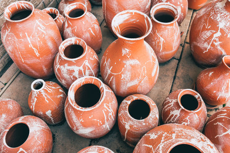 Clay jugs of different sizes and shapes on the floor. Craftの写真素材