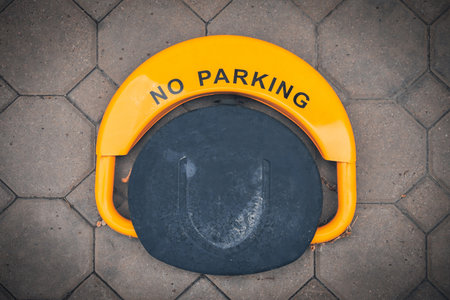 Parking barrier with folded position. Road restrictionsの写真素材
