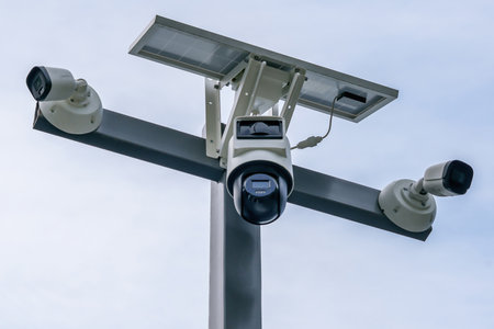 Outdoor surveillance cameras with solar panel. Security and control system. Energy savingの写真素材