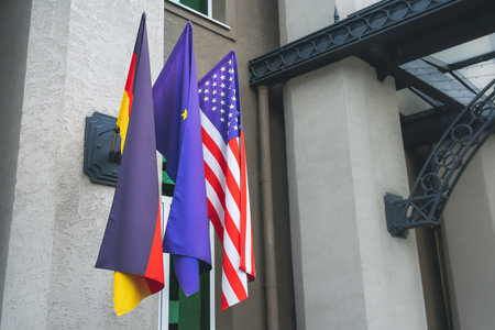 Flag of Germany, United States of America and European Union on a flagpole. Political relationsの写真素材