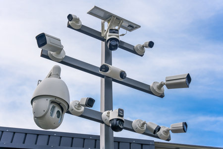 Street surveillance cameras of different modifications on one stand. Security and control systemの写真素材