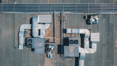 Chillers with air ducts on the roof of the building. Climate control. View from above
