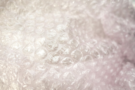 Plastic bubble wrap close up with white highlightsの写真素材