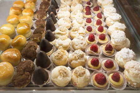 lots of backed pastries in a row