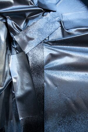 uneven crinkly gued taped silver blue spray painted wall paper poster effect background textured...