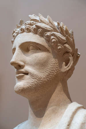 Manhattan, New York, USA, 03/28/2018, High clasical greek style limestone head statue with a Laurel wreathのeditorial素材