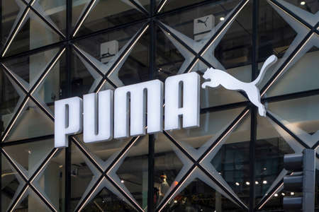 Manhattan, New York City, USA 11-26-2020, Puma logotype and jumping puma cat Flagship Store on Fifth Avenueのeditorial素材