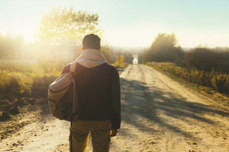 Man is hitchhiking on the background of the road. Travelの写真素材