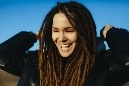 Woman smiling on background of nature. Beautiful. smile. Nature.の写真素材