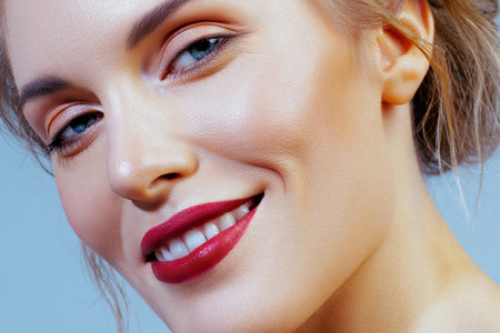 Young woman with red lips, straight teeth and radiant smile. Dental Health, Care and Dentistryの写真素材