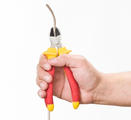 hand with cutting pliers