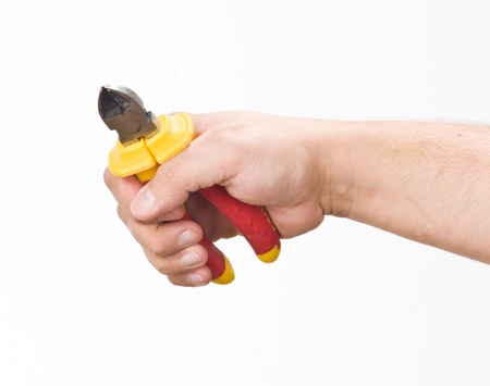 hand with cutting pliersの写真素材
