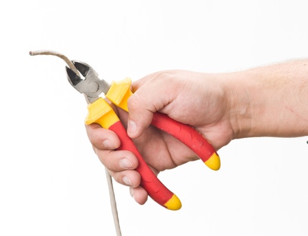 hand with cutting plierの写真素材