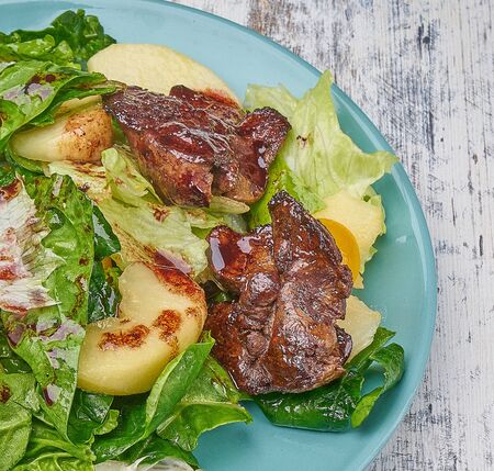 chicken kidney warm salad with greens and avocadoの写真素材